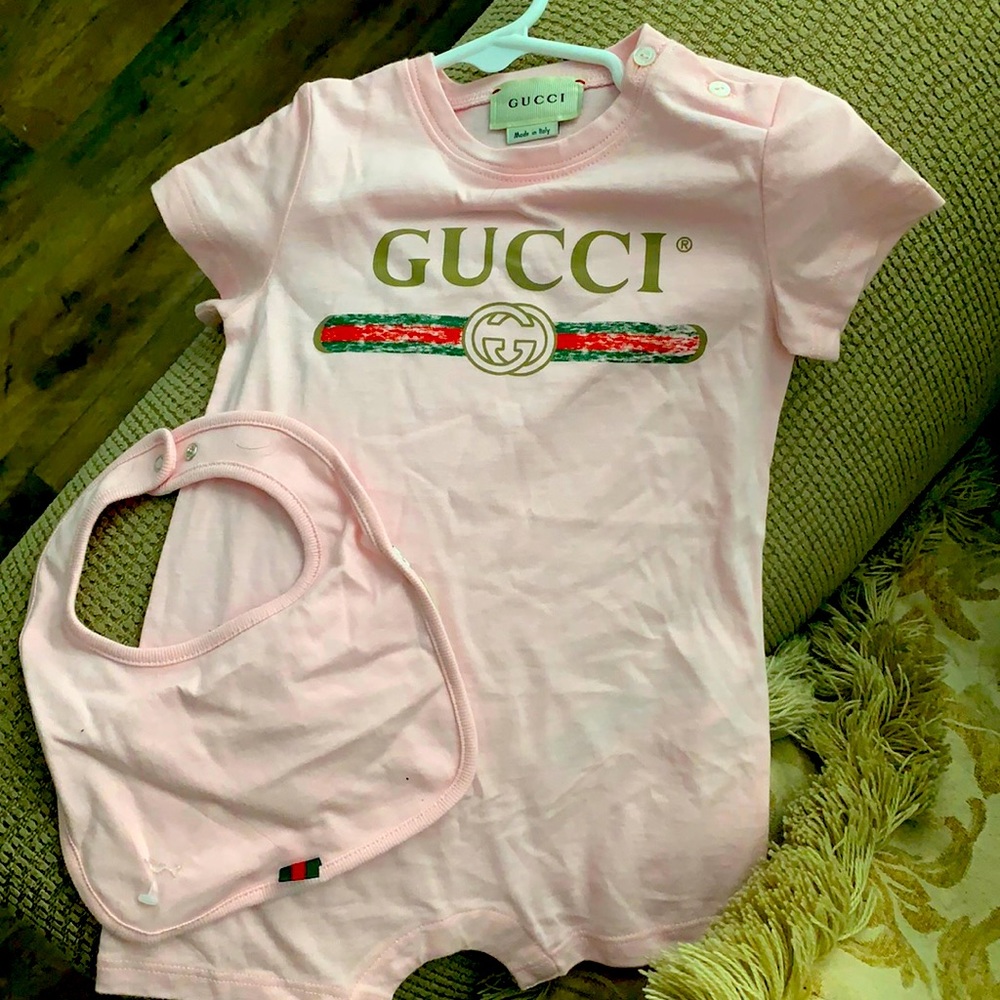 Gucci baby onsie size 6-9 months and matching bib.